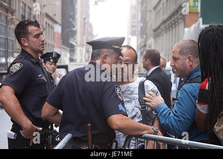 Police officers with the New York City Police Department block access ...