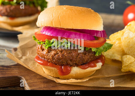 Healthy Vegan Vegetarian Meat Free Burger with Lettuce Tomato and Onion Stock Photo