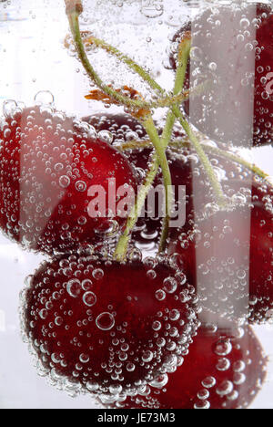 Juicy cherries or cherries in the water under the fogged glass