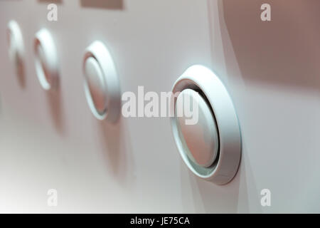 Showcase with plastic covers for air vents closeup. Forced ventilation for bathroom, kitchen or house rooms Stock Photo