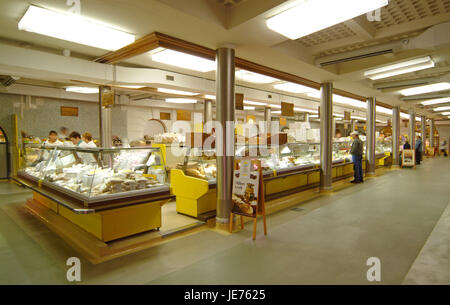 View in a covered market with sales booths of the bakers in Ljubljana, Stock Photo