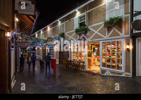 Pedestrian street scene, Swiss and German style European architecture, colourful Christmas decorations at Boulevard Geneve, Capivari, Campos do Jordao Stock Photo