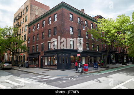 4-story red brick residential building on the corner of bleeker street and bank st greenwich village New York City USA Stock Photo