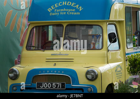 Vintage Bedford van selling Beechdean Ice Cream (no customers) parked at first RHS Chatsworth Flower Show, Chatsworth House, Derbyshire, England, UK. Stock Photo