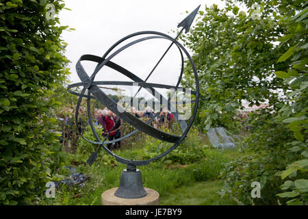 View of show garden at first RHS Chatsworth Flower Show, Chatsworth House, Derbyshire, England, UK - armillary sphere in Belmond Enchanted Gardens. Stock Photo