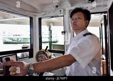 Hong Kong, China. 13th June, 2017. The captain sails the Star Ferry on the route linking Wan Chai and Tsim Sha Tsui in Hong Kong, south China, June 13, 2017. July 1, 2017 marks the 20th anniversary of Hong Kong's return to the motherland. Credit: Wang Xi/Xinhua/Alamy Live News Stock Photo