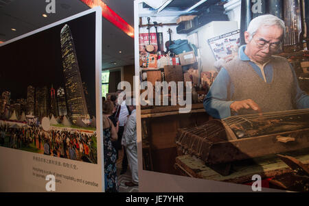 (170623) -- GENEVA, June 23, 2017 (Xinhua) -- People visit a photo exhibition in Geneva, Switzerland, on June 22, 2017. The photo exhibition was held here Thursday to celebrate the 20th anniversary of Hong Kong's return to China. (Xinhua/Xu Jinquan)(gj) Stock Photo