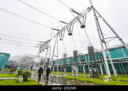 Jinhua, China's Zhejiang Province. 23rd June, 2017. Staff members inspect the convertor station in Jinhua, east China's Zhejiang Province, June 23, 2017. The Sichuan Xiluodu-Zhejiang Jinhua 800 KV ultra-high voltage (UHV) direct current (DC) power transmission project, one of the world's largest DC power transmission projects in terms of capacity, has transmitted over 100 billion kwh clean hydropower into Zhejiang by now. Credit: Xu Yu/Xinhua/Alamy Live News Stock Photo