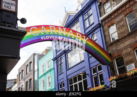 London, UK. 23rd June, 2017. Pride 2017 is launched with a 'Pride Arch' in Carnaby Street on the theme of Love Happens Here. The arch is intended as a visualisation of love conquering hate, of a community coming together to overcome hate, and was launched in conjunction with West End property company Shaftesbury. Credit: Mark Kerrison/Alamy Live News Stock Photo