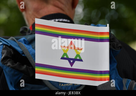 Berlin, Germany. 23rd June, 2017. A pro-Israeli protestor with an Israeli flag in rainbow colours during a demonstration against Al-Quds Day in Berlin, Germany, 23 June 2017. Al-Quds Day, which takes its name from the Arabic name of Jerusalem, is an Iranian-sponsored show of solidarity with Palestinians and against Israel. The day is a national holiday in Iran. Demonstrations are held in the US, Canada, the UK, Sweden and Germany as well as the Middle East. Photo: Paul Zinken/dpa/Alamy Live News Stock Photo