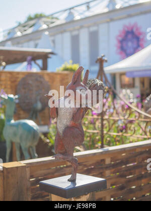 LONDON, UK - MAY 25, 2017: RHS Chelsea Flower Show 2017. Squirrel garden figure. Stock Photo