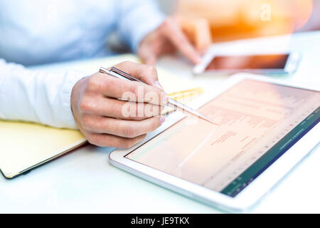 Accounting on a tablet computer, close-up Stock Photo