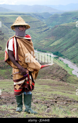 Man wearing traditional Basotho hat Thaba-Tseka District Lesotho Southern Africa Stock Photo