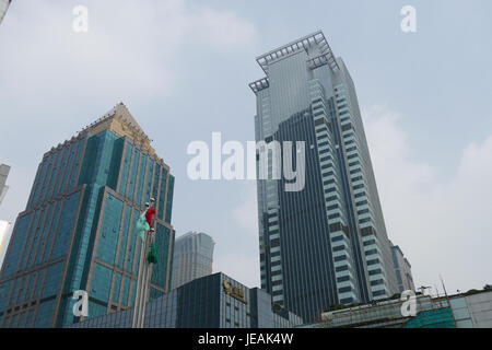 A photograph of buildings along Nanjing West Road in Shanghai, taken on November 17, 2014, capturing the urban architecture and cityscape of one of the busiest streets in the city. Stock Photo