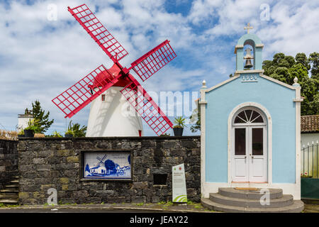 Pico Vermelho windmill on the coast of Sao Miguel Island, the Azores archipelago in the Atlantic Ocean belonging to Portugal Stock Photo