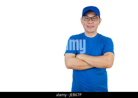 Asian Chinese man wearing blue shirt with crossed arm in isoalted white background. Stock Photo
