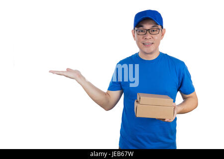 Asian Chinese delivery guy in uniform with open palm in isolated white background. Stock Photo