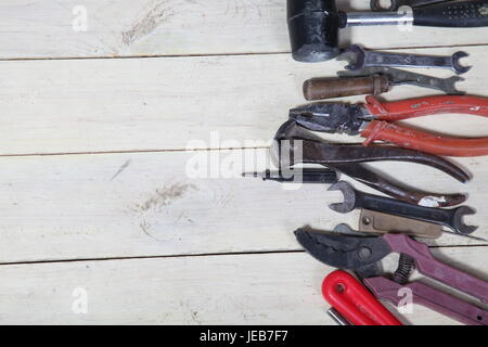 tools for repairs lies on the white boards Stock Photo