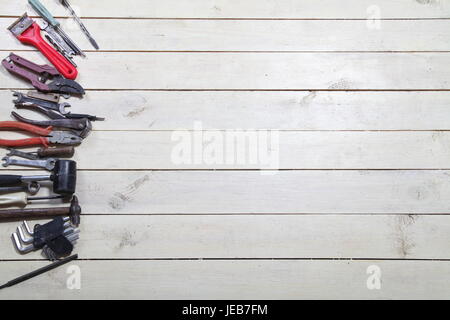 tools for repairs lies on the white boards Stock Photo