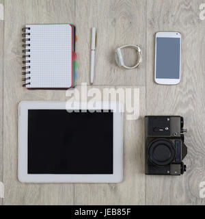 Flat lay of  objects for photographers. Overhead view of photography accessories. Different objects on wooden background. Stock Photo
