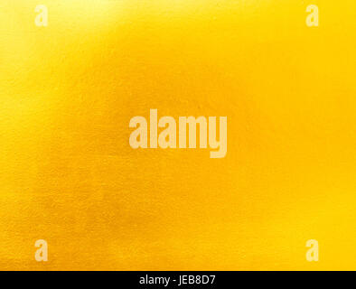 Gold foil texture background  backdrop smooth seamless abstract. Stock Photo