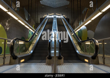 Two moving underground escalator in the subway from the front Stock Photo