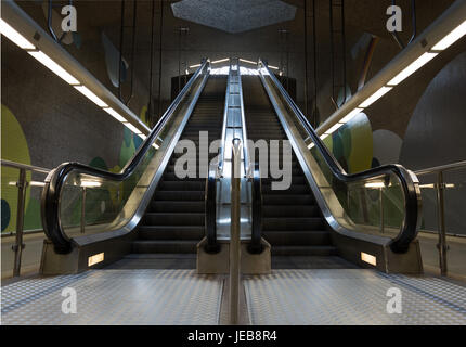 Two moving underground escalator in the subway from the front Stock Photo