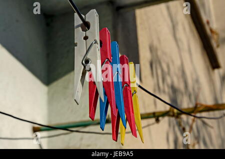 Coloured plastic clothes pins or peg on rope, Sofia, Bulgaria Stock Photo