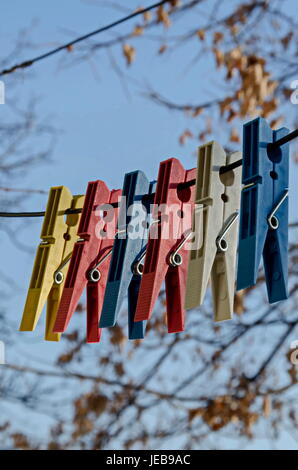 Coloured plastic clothes pins or peg on rope, Sofia, Bulgaria Stock Photo