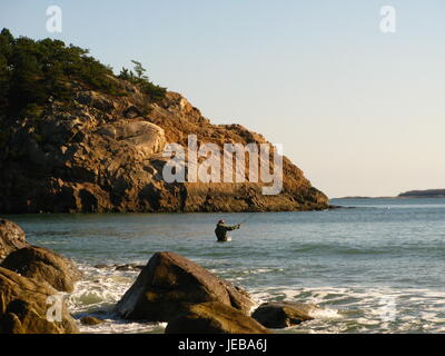 Fisherman in the sea Stock Photo