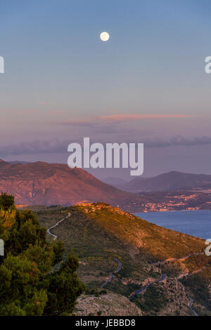 Moonrise at sunset from the top of Mount Srd, Dubrovnik, Croatia. Stock Photo