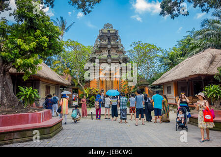 BALI, INDONESIA - APRIL 05, 2017: Unidentified people taking pictures in Puri Kantor a Hindu temple in the center of Ubud, Bali, Indonesia. Stock Photo