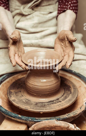 Close up of female hands working on potters wheel Stock Photo