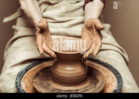 Close up of female hands working on potters wheel Stock Photo