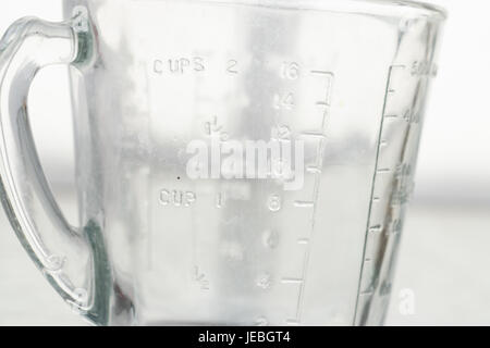 Measuring mug on a white background Stock Photo