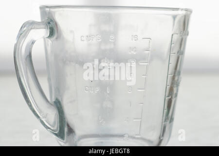 Measuring mug on a white background Stock Photo