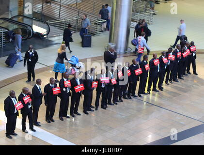 Johannesburg South Africa - courtesy vehicle drivers line up in the arrivals hall of the O.R.Tambo International Airport in the city Stock Photo