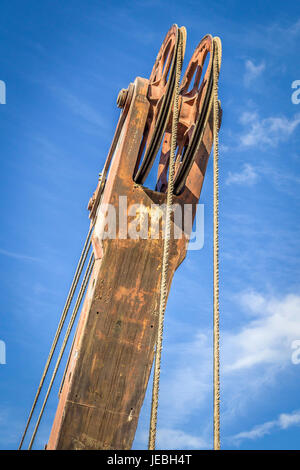 Boom hoist close-up on a background of blue sky Stock Photo