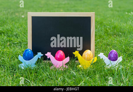 Colorful Easter eggs with chalkboard Stock Photo