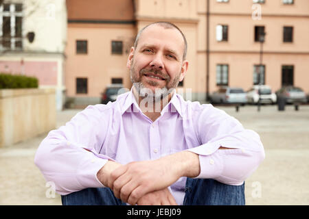 Portrait of relaxed businessman in urban space. Stock Photo