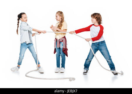 Children play tug of war, boy vs girls, kids sport isolated concept Stock Photo