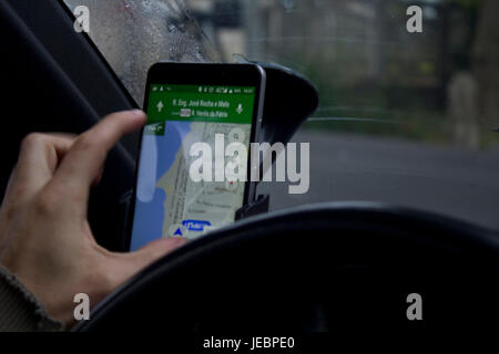 Man using google maps on smartphone Stock Photo