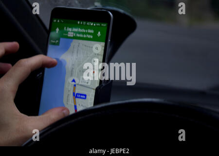 Man using google maps on smartphone Stock Photo