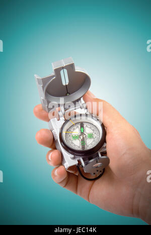 Hand with compass, Stock Photo