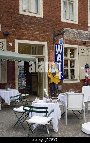 Germany, Brandenburg, Potsdam, Dutch fourth, cafe, outside, postal card rack, town, town fourth, basin square, brick building, architectural style, brick, red, window, input, souvenir shop, postcards, sign, gastronomy, restaurant, tables, covered, table caps, chairs, nobody, tourism, Stock Photo
