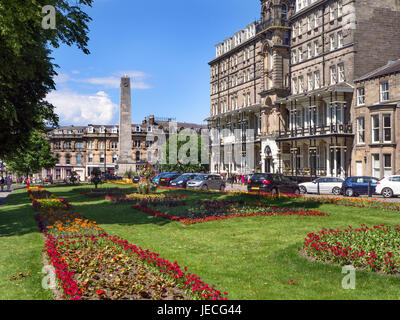 War Memorial and The Yorkshire Hotel on West Park in Harrogate North Yorkshire England Stock Photo