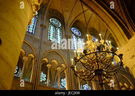 Inside Notre Dame Cathedral in Paris looking up at the high ceiling and stained glass windows Stock Photo