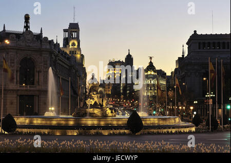 Spain, Madrid, Metropolis building at night, fountain in the foreground, Stock Photo