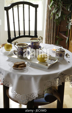 Coffee table, covered, porcelain, elegantly, lemons, table, around, tablet, dishes, china, tea service, two, cups, tea drinking, Teatime, biscuits, sugar bowl, teaspoon, table caps, white, tea warmer candle, skyer light, chair, nobody, Stock Photo