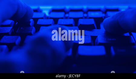 Worker working using PC computer. POV man typing on computer keyboard Stock Photo